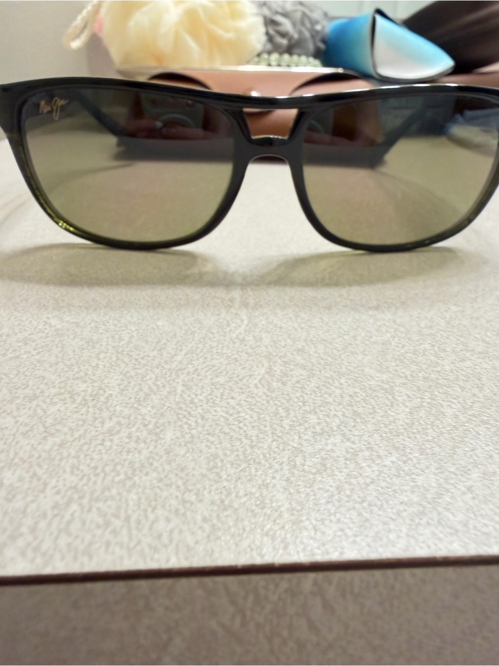 Maui Jim Black Frame Sunglasses with Green-Tinted Lenses
